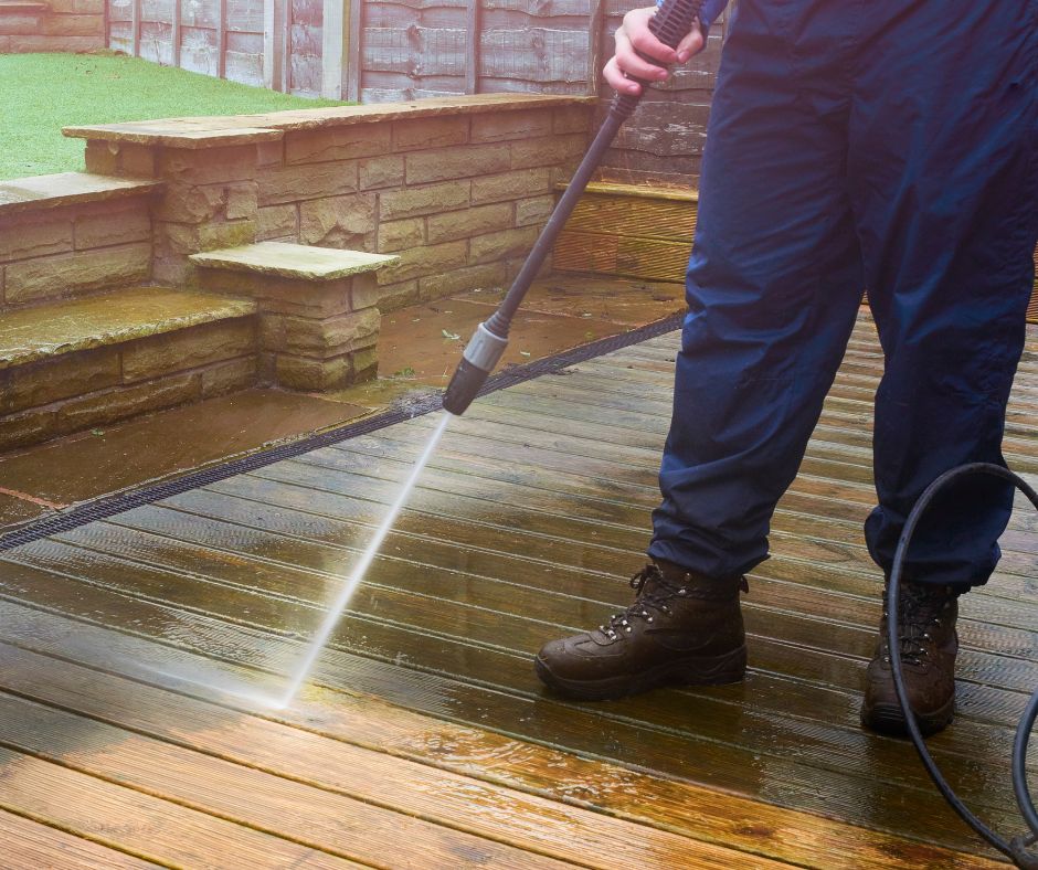 person using pressure washer for deck cleaning Maryborough